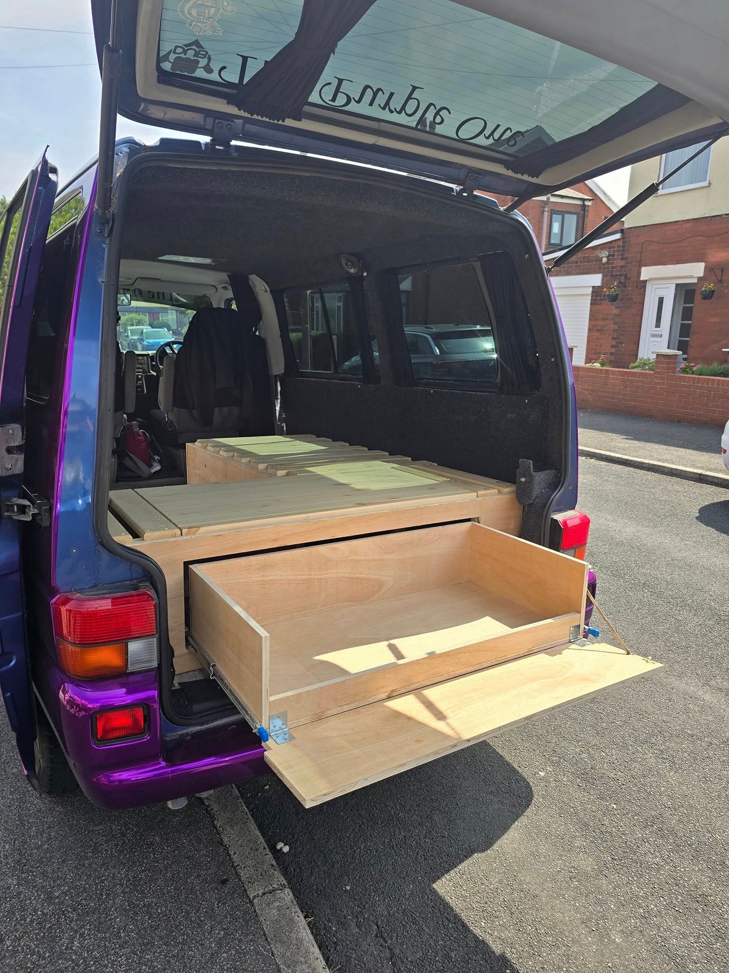 VW Caravelle L-Shape Seating/Pull out bed - Optional Heavy duty Pull-Out Drawer/Kitchen Unit. VW L-Shape seating