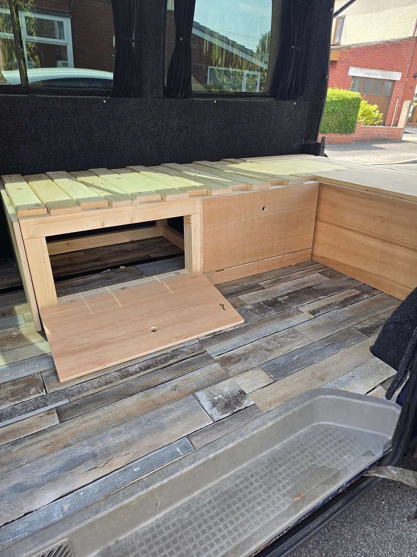 VW Caravelle L-Shape Seating/Pull out bed - Optional Heavy duty Pull-Out Drawer/Kitchen Unit. VW L-Shape seating